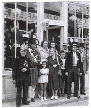 A few members of the Downtown Committee in front of the confectionery store